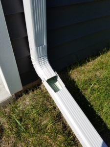Hinged downspout in down position